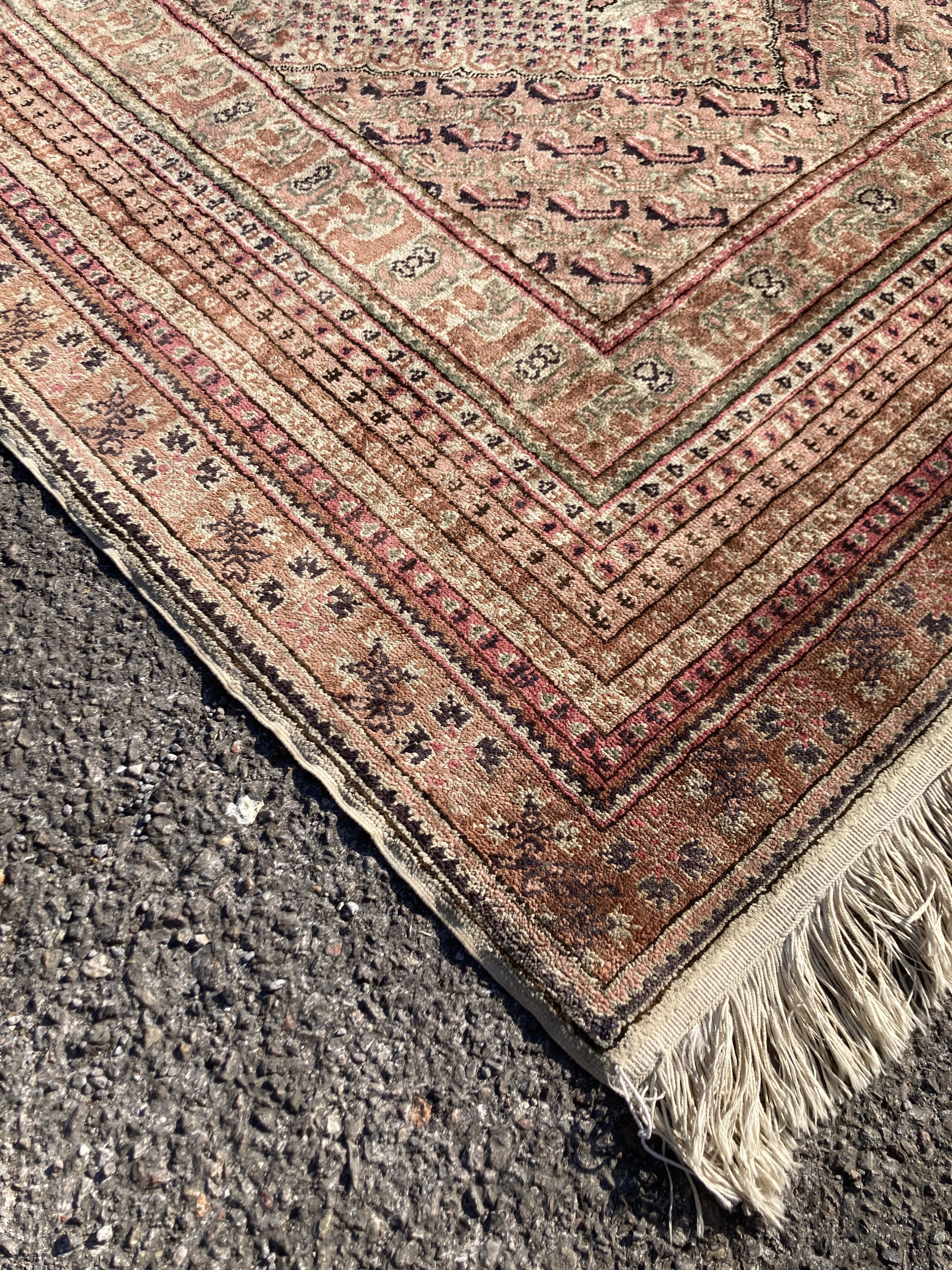 A North West Persian red ground rug, decorated with Saz leaf field, 190 x 125cm